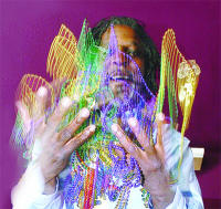King David tosses  a bunch of Mardi Gras beads